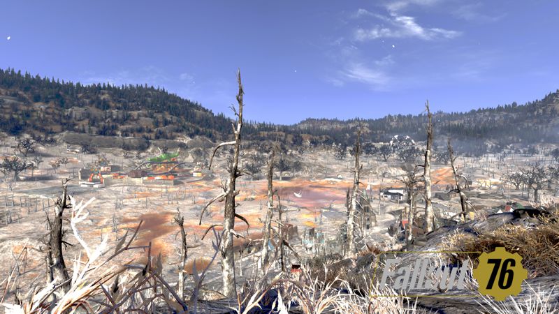 Wide landscape shot showing devastated trees and countryside.