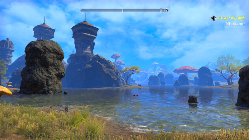 images shows temple on large rocks across a lake